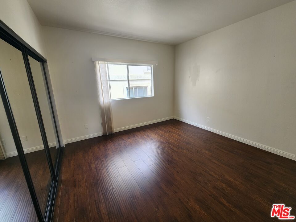 4328 Whitsett Avenue, Unit 4 Studio City, CA 91604 - Photo 4 of 73 a view of an empty room with wooden floor and a window