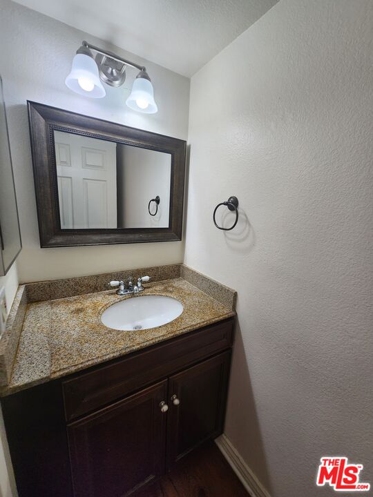 4328 Whitsett Avenue, Unit 4 Studio City, CA 91604 - Photo 54 of 73 a bathroom with a granite countertop sink and a mirror