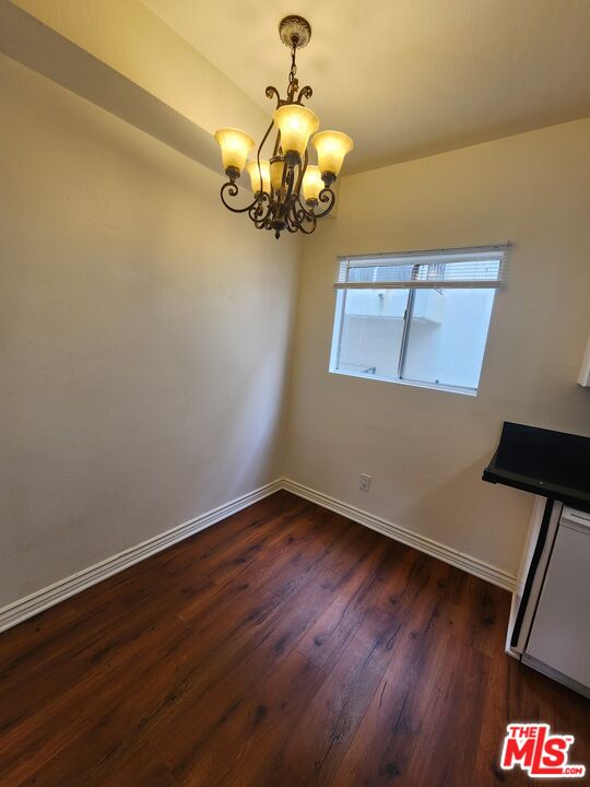 4328 Whitsett Avenue, Unit 4 Studio City, CA 91604 - Photo 59 of 73 a view of a room with wooden floor and chandelier