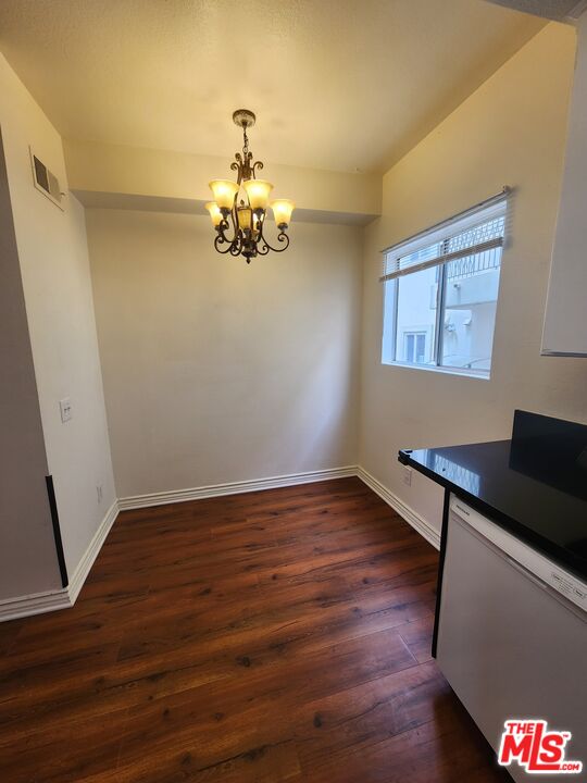 4328 Whitsett Avenue, Unit 4 Studio City, CA 91604 - Photo 61 of 73 a view of a room with wooden floor and painting on the wall