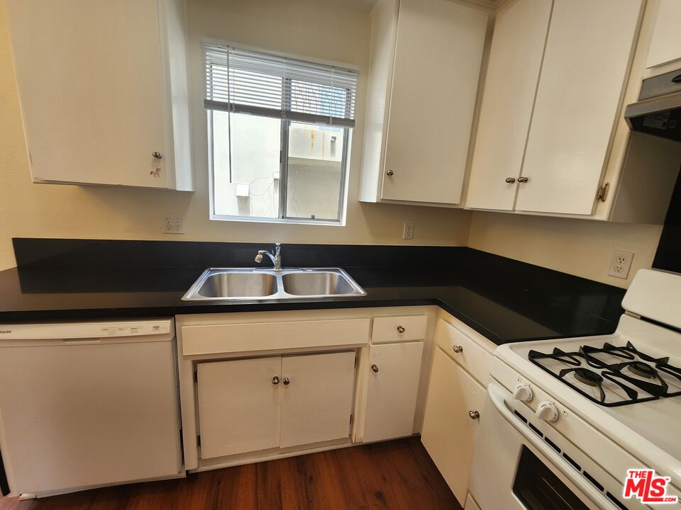 4328 Whitsett Avenue, Unit 4 Studio City, CA 91604 - Photo 67 of 73 a kitchen with cabinets appliances a sink and a window