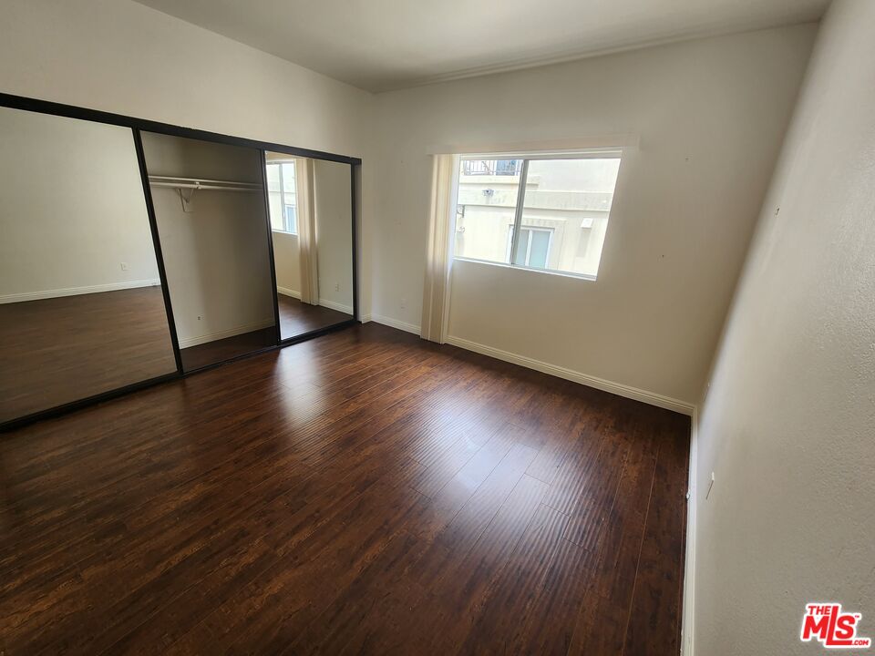 4328 Whitsett Avenue, Unit 4 Studio City, CA 91604 - Photo 7 of 73 a view of an empty room with wooden floor and a window