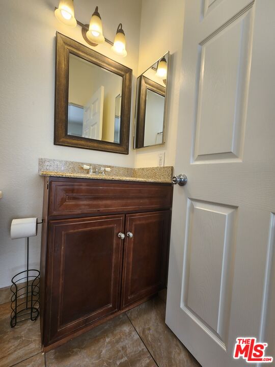 4328 Whitsett Avenue, Unit 4 Studio City, CA 91604 - Photo 10 of 73 a bathroom with a granite countertop sink and a mirror