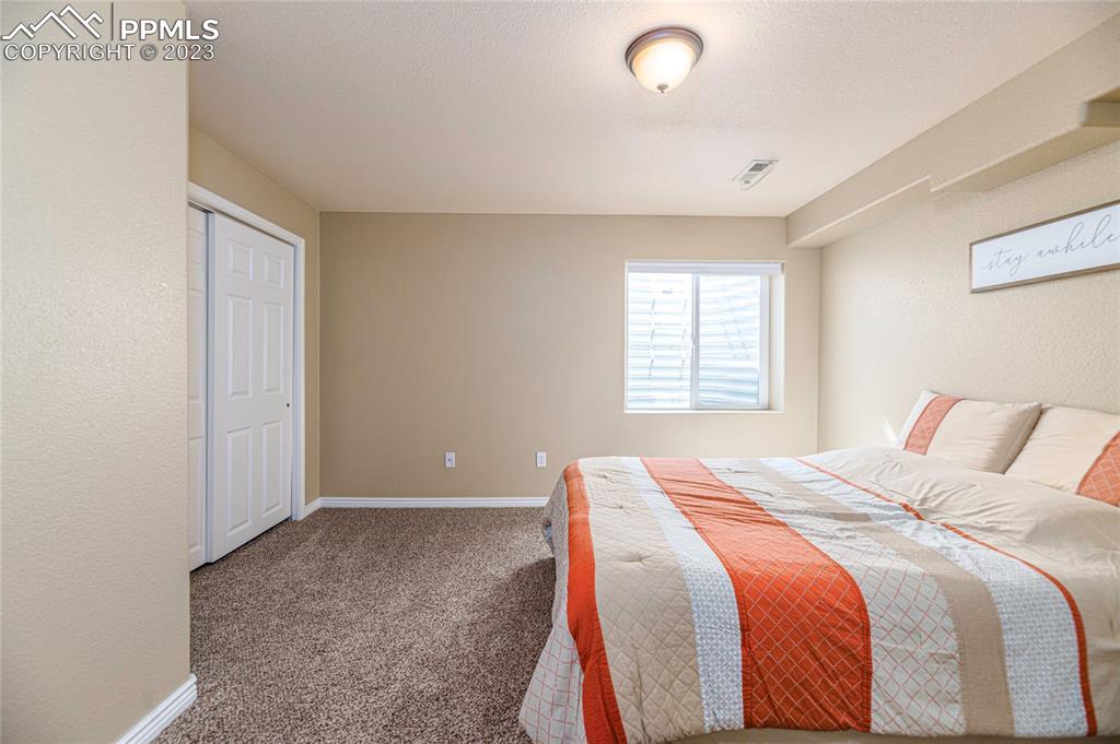 12713 Pine Valley Circle Peyton, CO 80831 - Photo 19 of 26 a bedroom with a bed and a window