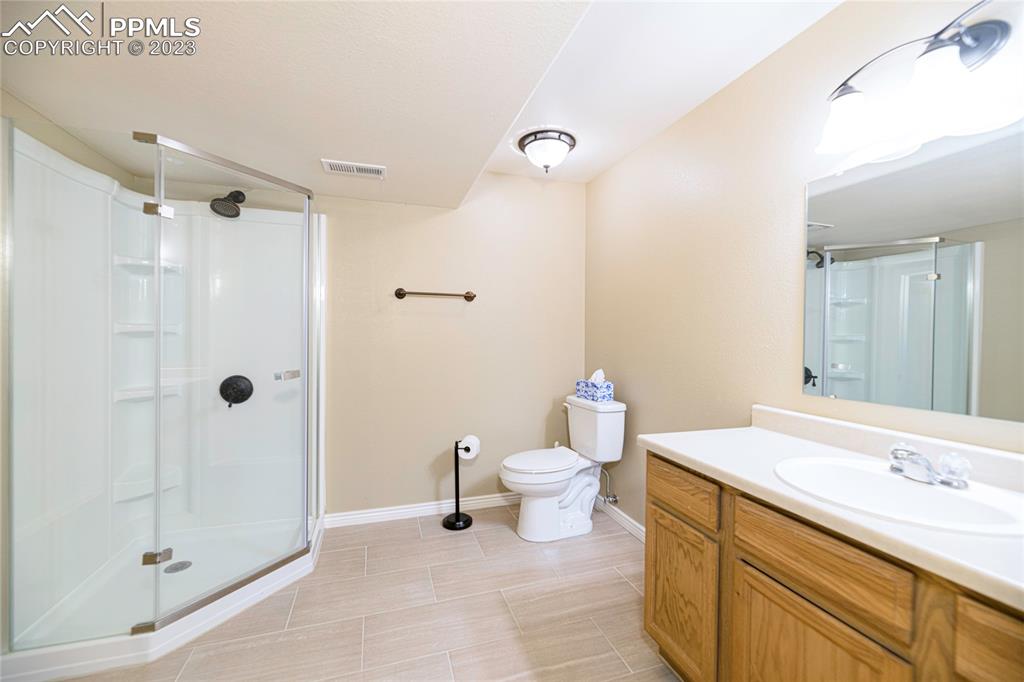 12713 Pine Valley Circle Peyton, CO 80831 - Photo 21 of 26 a bathroom with a sink and a mirror