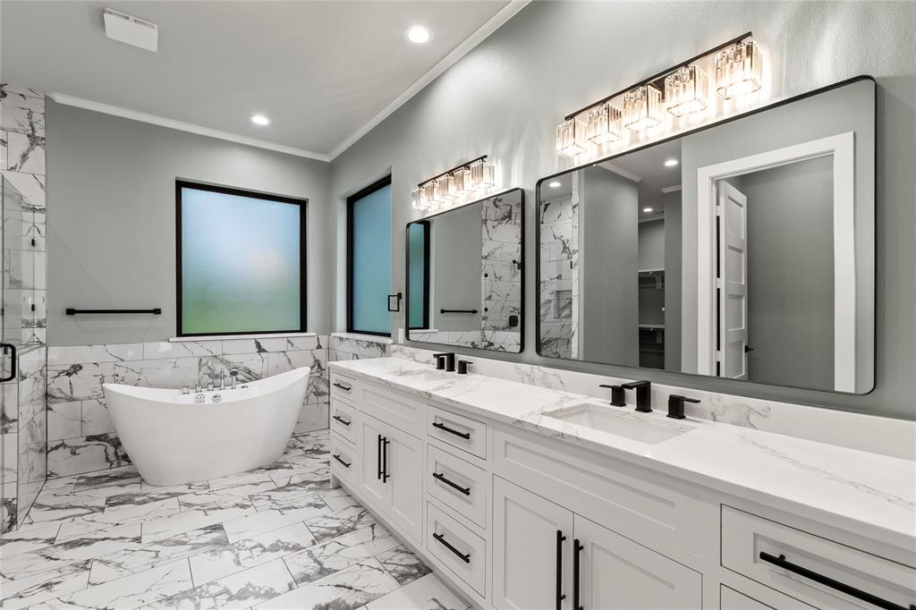 4054 Smothers Road Caney City, TX 75148 - Photo 11 of 40 Luxurious primary bath with freestanding soaking tub, oversized walk-in shower, dual vanities, and direct access to the custom closet.