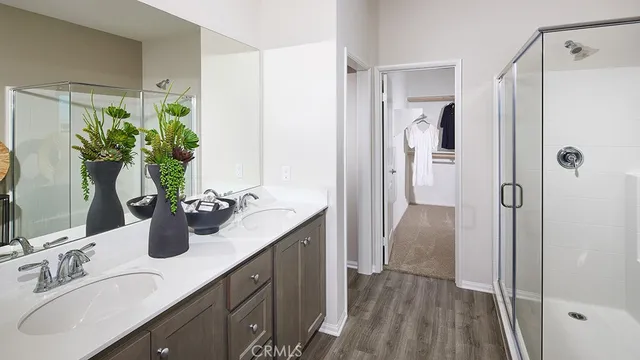 a bathroom with a double vanity sink and mirror