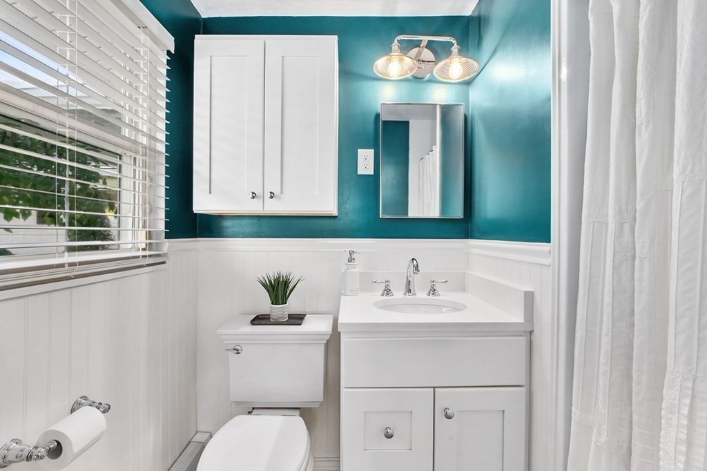 26 Doris Road Framingham, MA 01701 - Photo 11 of 36 a bathroom with a sink vanity and mirror