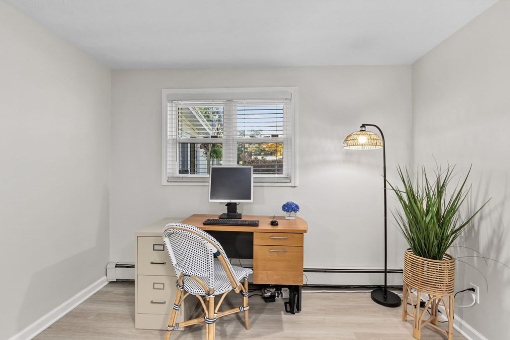 26 Doris Road Framingham, MA 01701 - Photo 16 of 36 a view of a workspace with furniture and a window