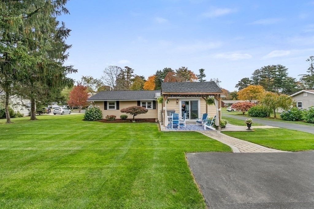 26 Doris Road Framingham, MA 01701 - Photo 27 of 36 a front view of house with yard and outdoor seating
