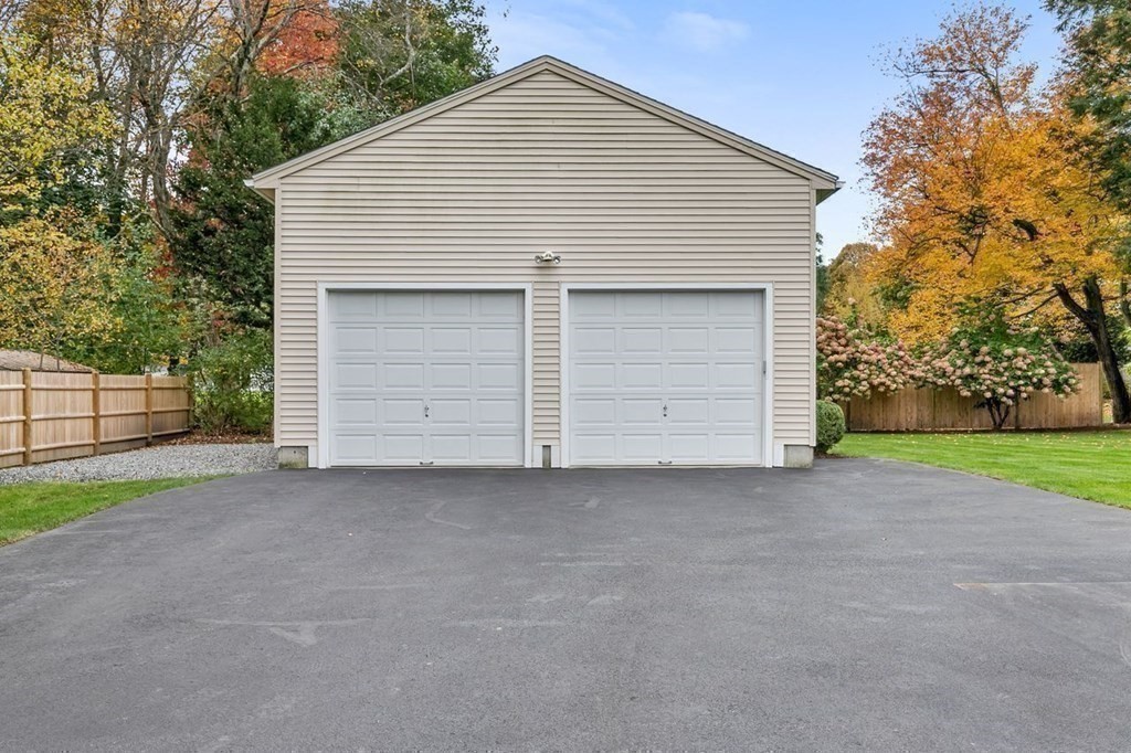 26 Doris Road Framingham, MA 01701 - Photo 34 of 36 a view of a house with a yard and garage
