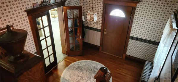 a view of entryway with wooden floor