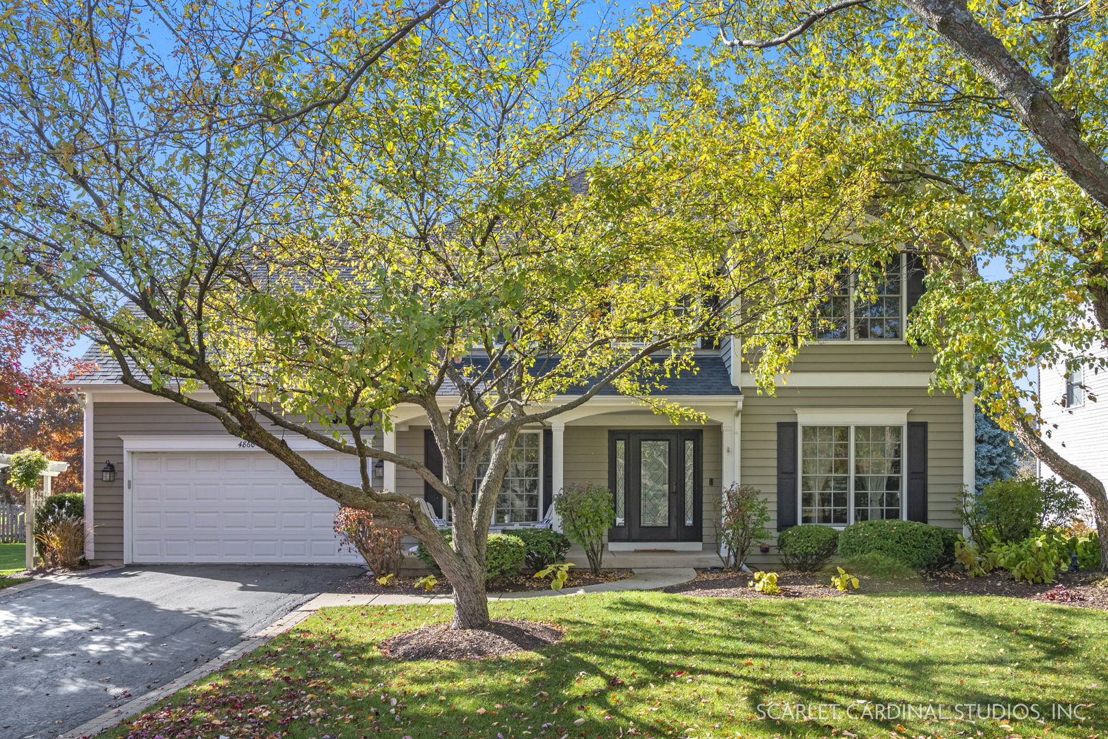 front view of a house with a yard