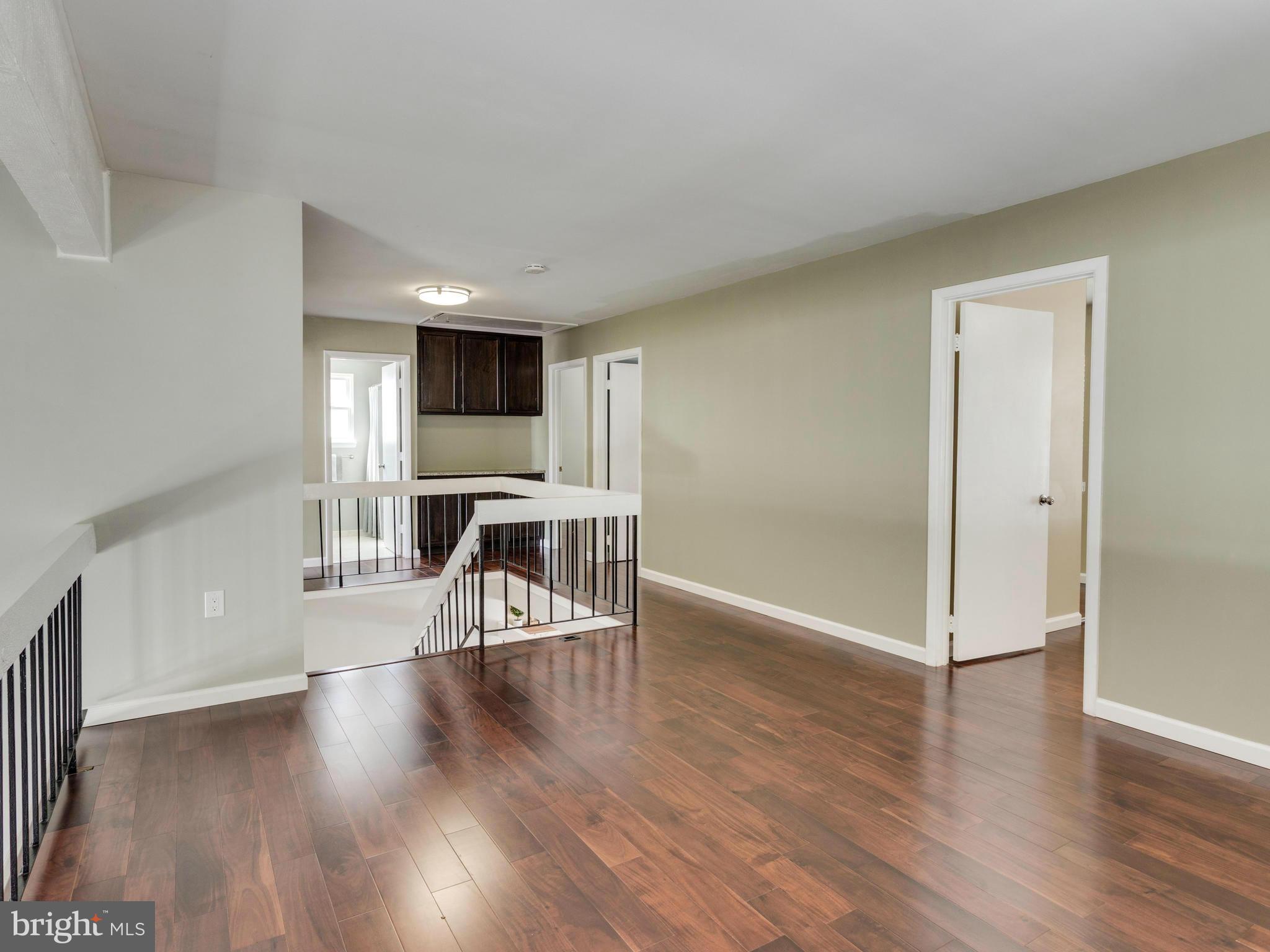 7604 Chancellor Way Springfield, VA 22153 - Photo 13 of 30 a view of a livingroom with wooden floor and furniture