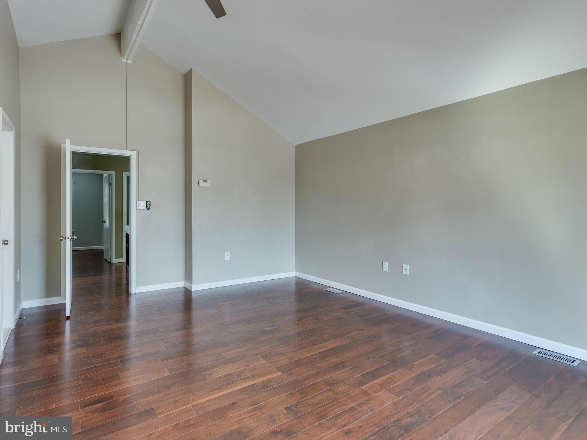 7604 Chancellor Way Springfield, VA 22153 - Photo 16 of 30 a view of an empty room with wooden floor and closet