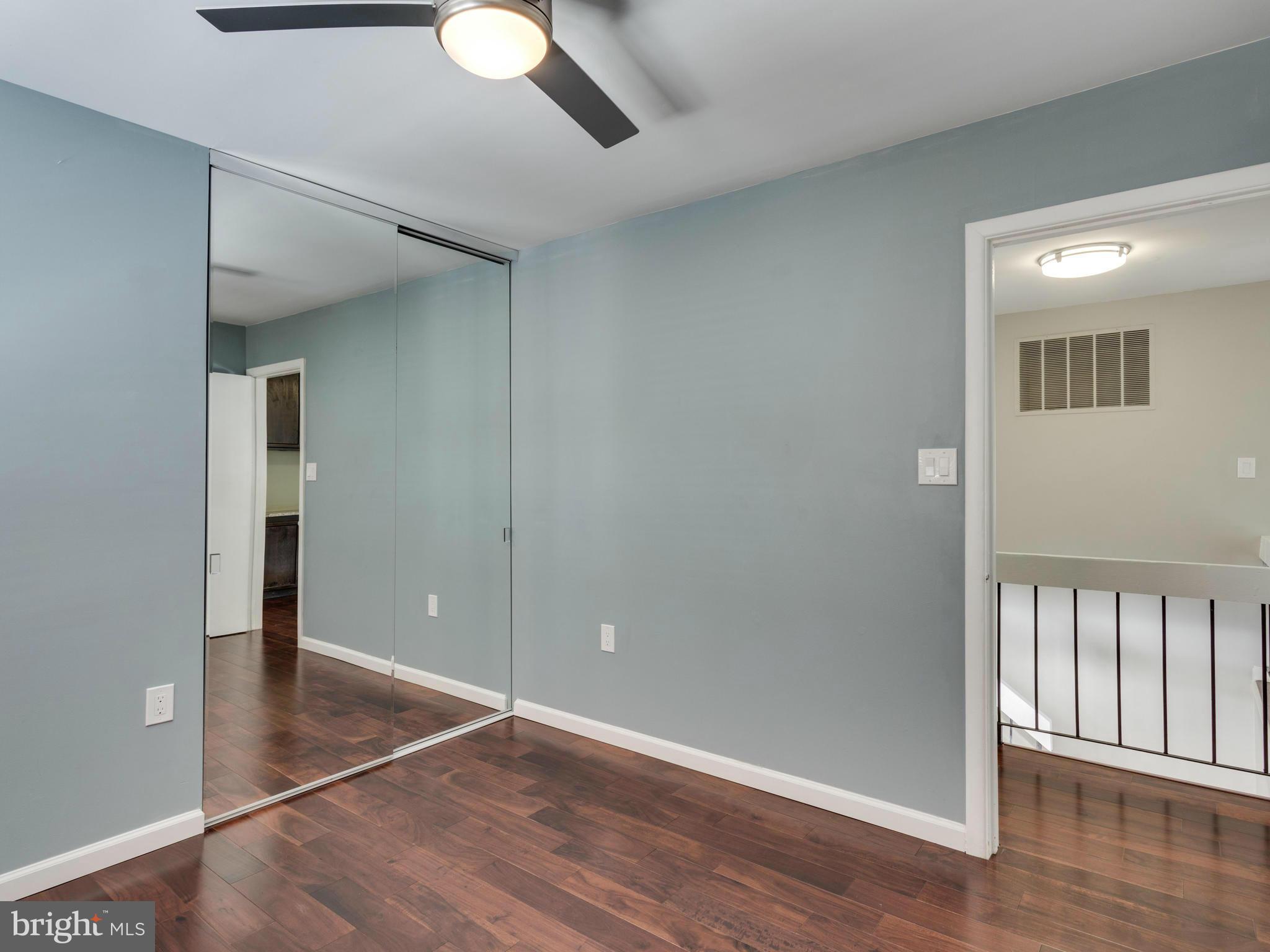 7604 Chancellor Way Springfield, VA 22153 - Photo 22 of 30 wooden floor in an empty room with a window