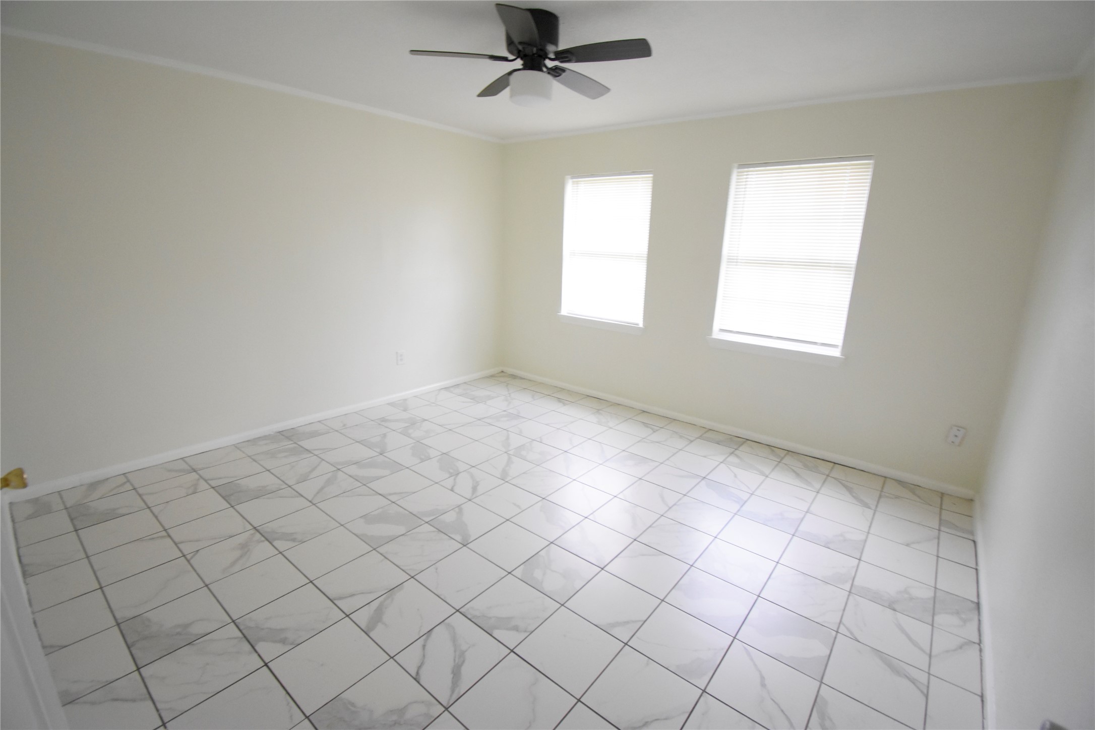 6229 Clover Ridge Street Houston, TX 77087 - Photo 22 of 25 an empty room with windows