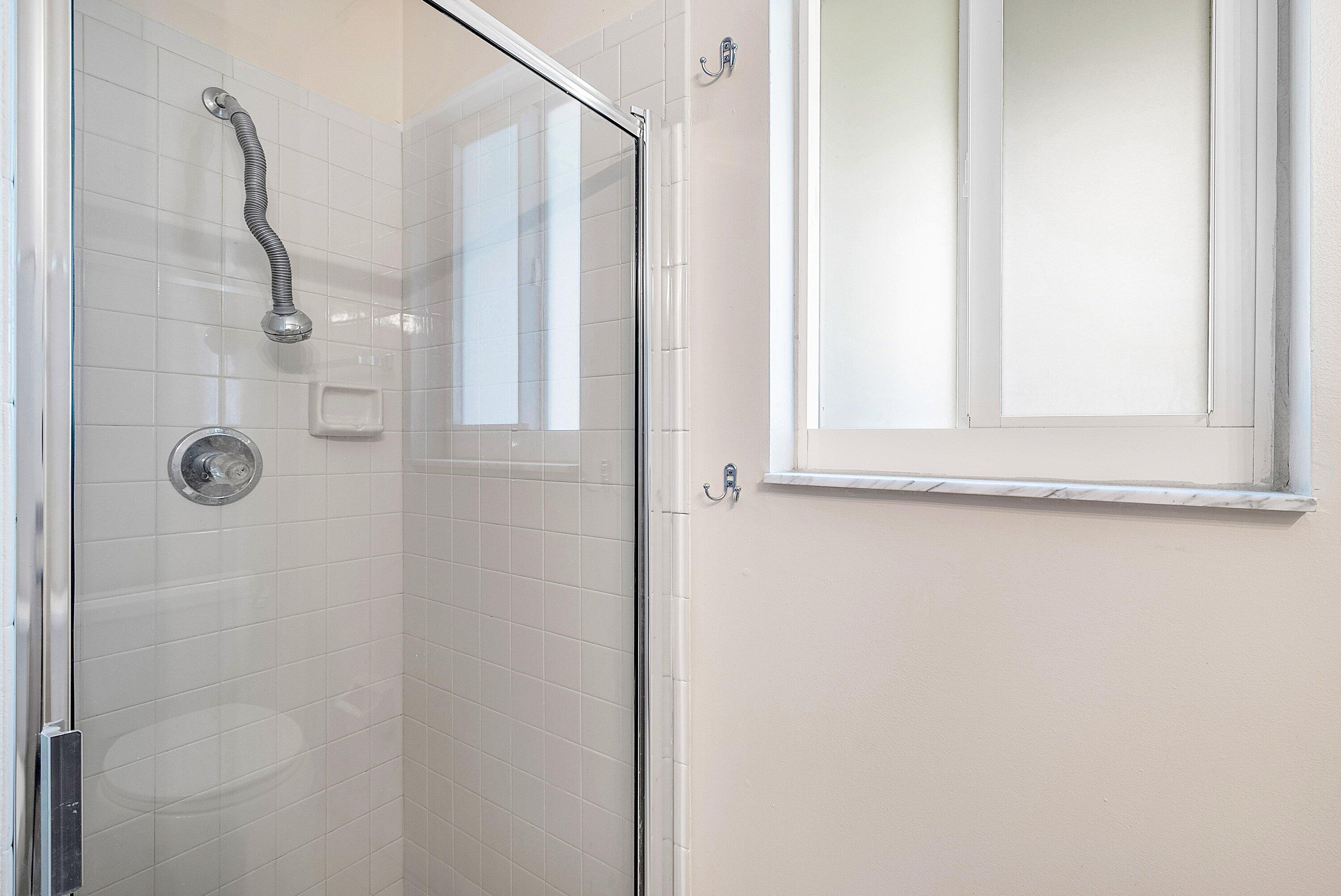165 Northwest 8th Street Boca Raton, FL 33432 - Photo 17 of 42 a bathroom with a shower