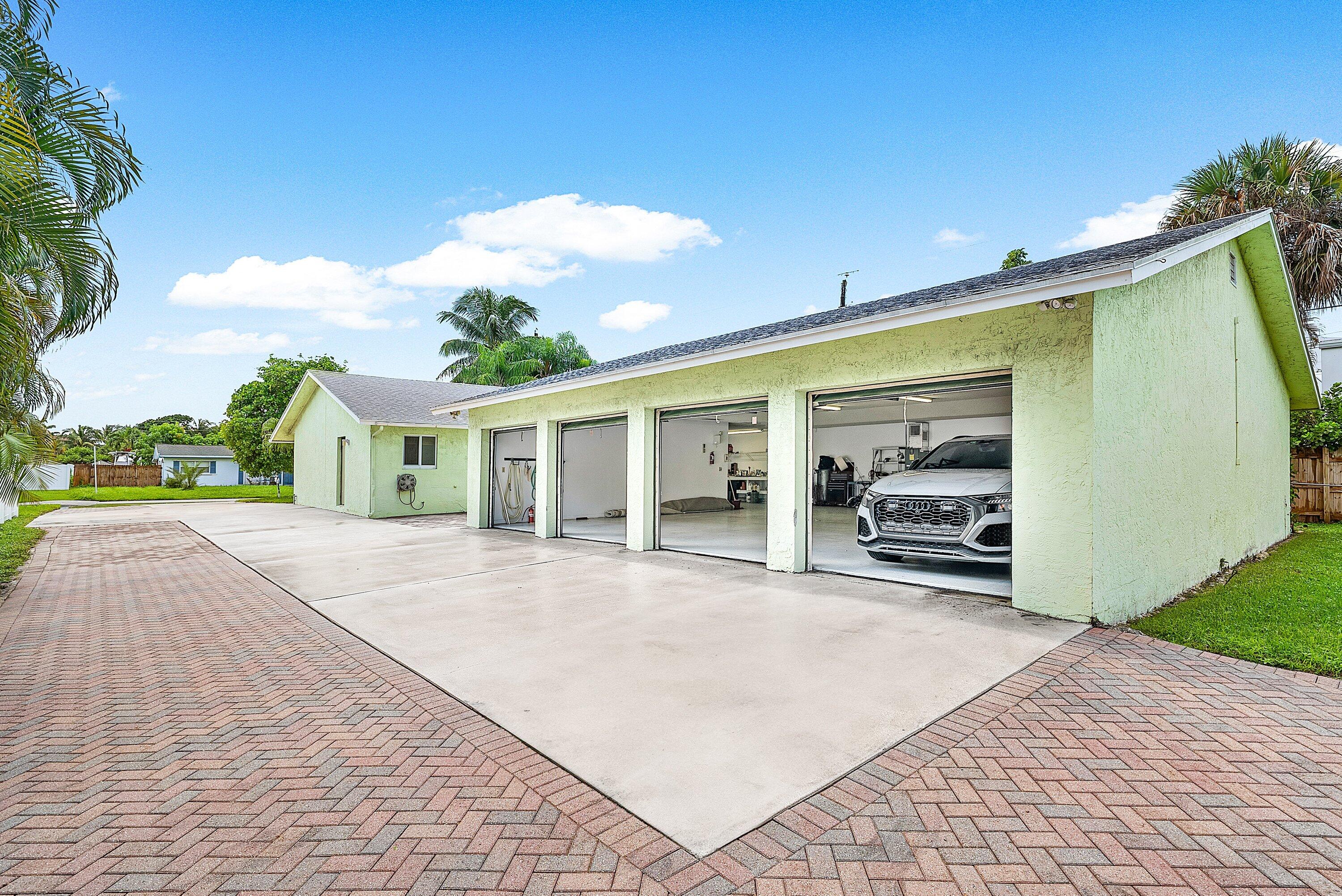165 Northwest 8th Street Boca Raton, FL 33432 - Photo 29 of 42 a view of a house with a backyard