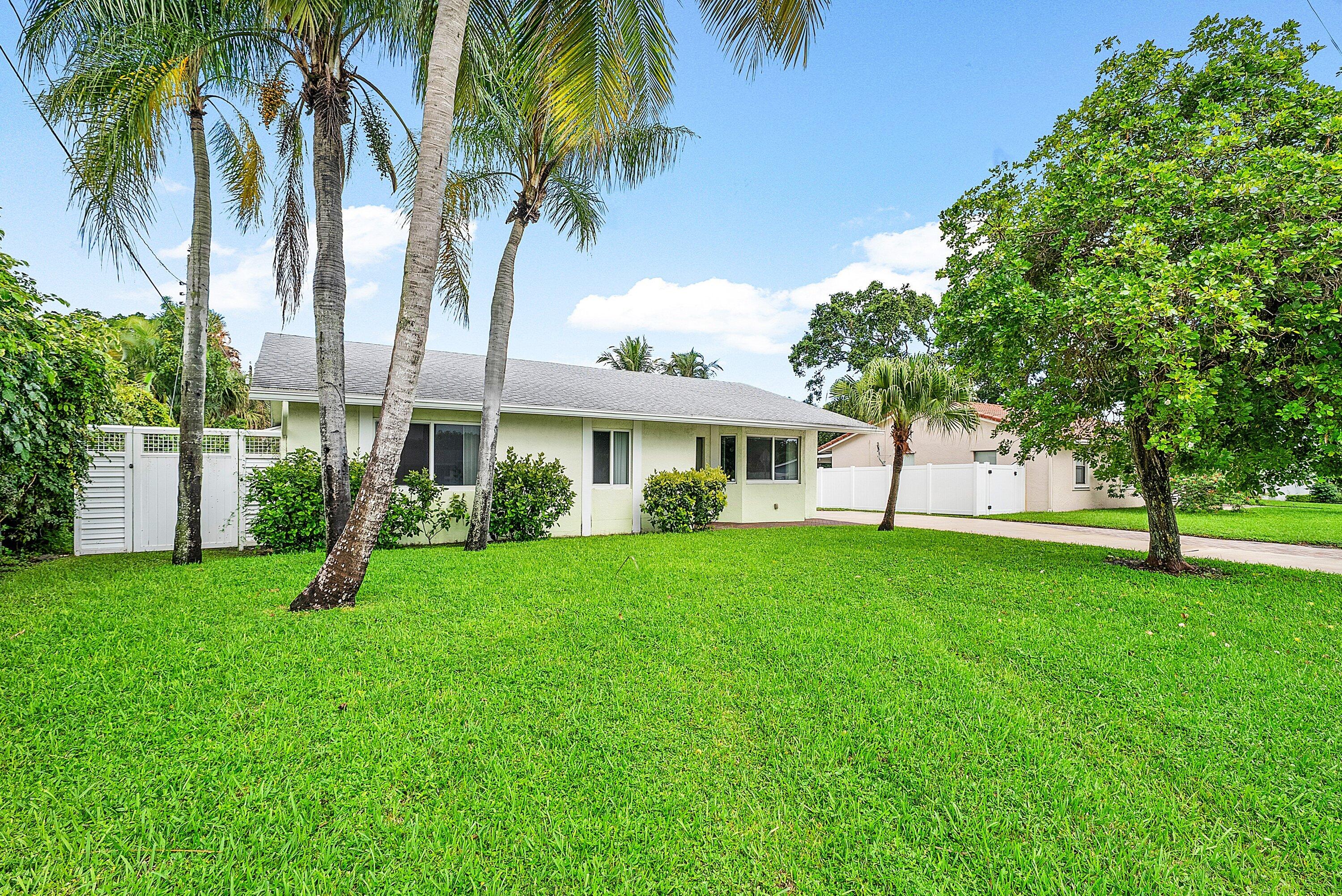 165 Northwest 8th Street Boca Raton, FL 33432 - Photo 32 of 42 a view of a house with a backyard
