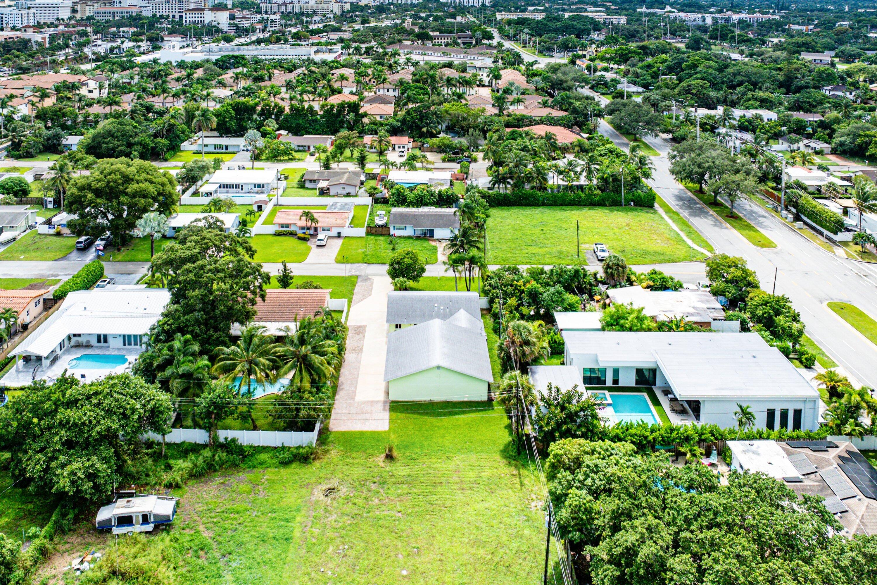 165 Northwest 8th Street Boca Raton, FL 33432 - Photo 39 of 42 an aerial view of residential houses with outdoor space and trees