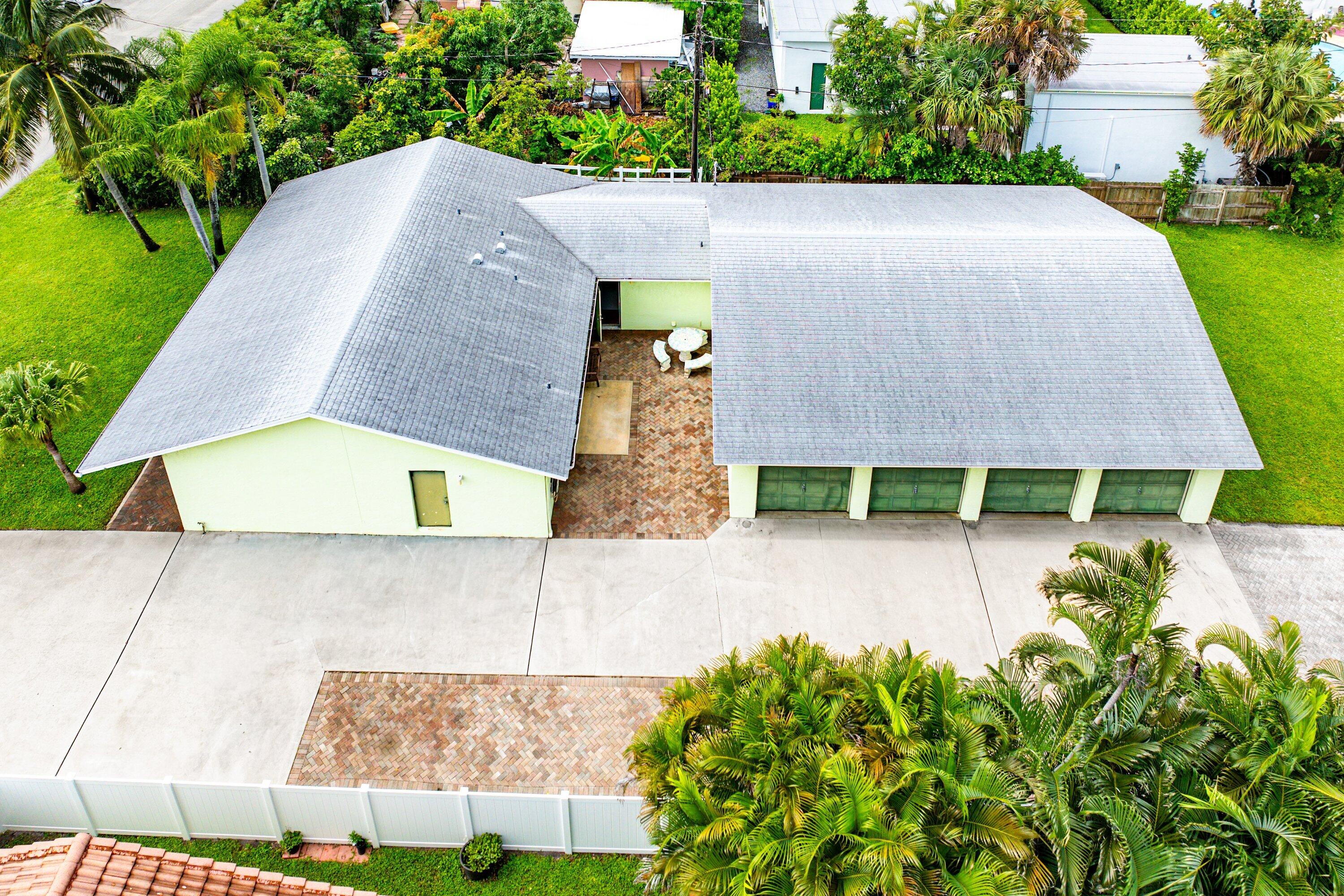 165 Northwest 8th Street Boca Raton, FL 33432 - Photo 4 of 42 an aerial view of a house with garden space and a patio