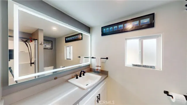 a bathroom with a shower and a tub