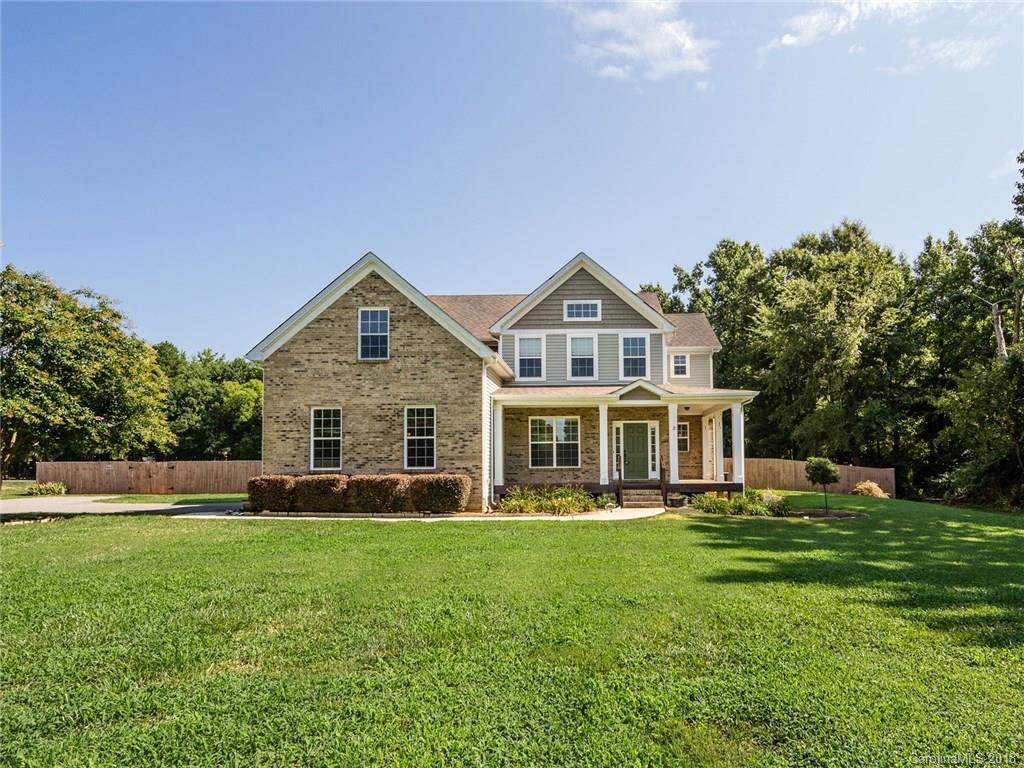 708 Baucom Road Monroe, NC 28110 - Photo 2 of 33 a front view of a house with a yard table and chairs