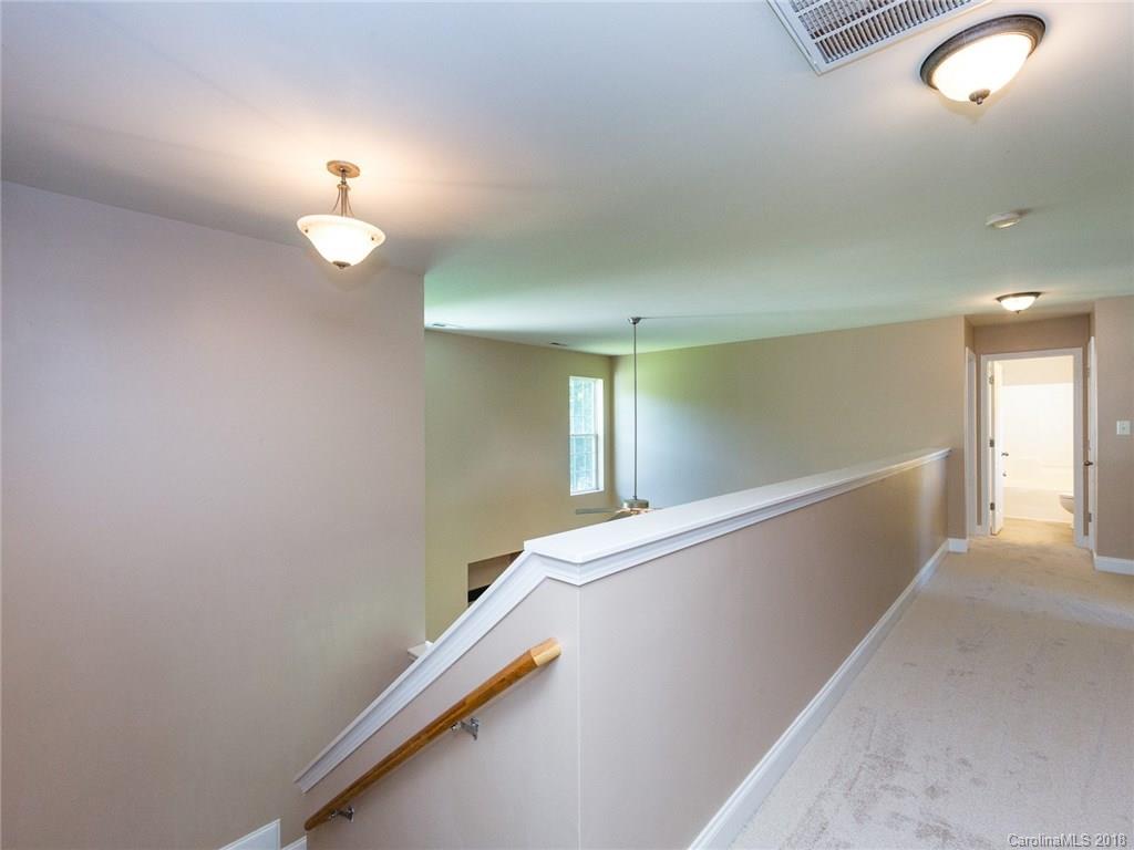 708 Baucom Road Monroe, NC 28110 - Photo 16 of 33 a view of a hallway with wooden floor