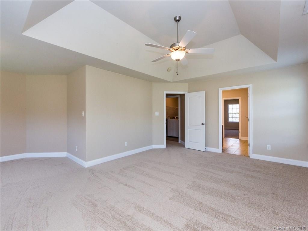 708 Baucom Road Monroe, NC 28110 - Photo 17 of 33 an empty room with fan and entrance