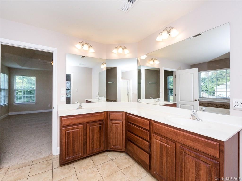 708 Baucom Road Monroe, NC 28110 - Photo 20 of 33 a kitchen with a sink and cabinets