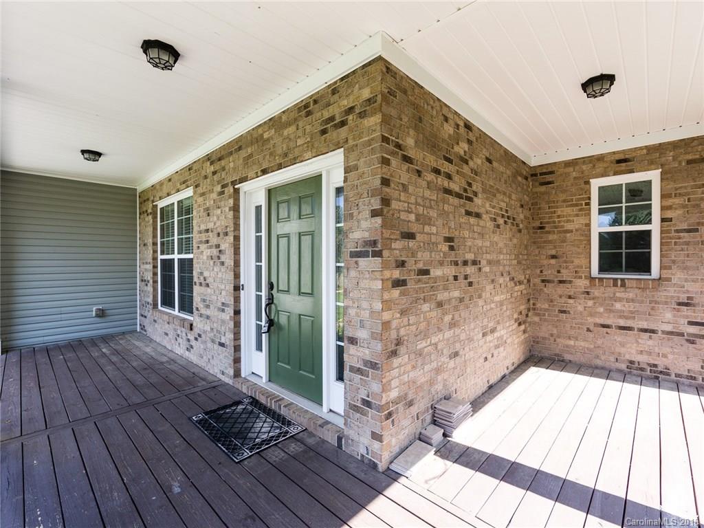 708 Baucom Road Monroe, NC 28110 - Photo 3 of 33 a view of a brick house with wooden floor