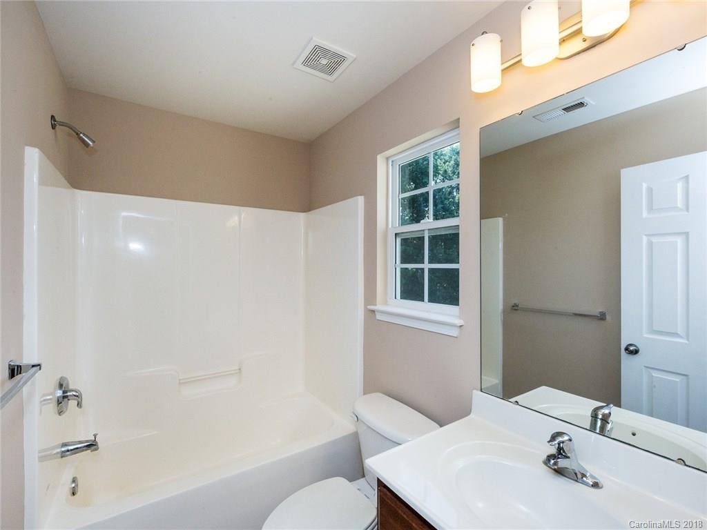 708 Baucom Road Monroe, NC 28110 - Photo 24 of 33 a bathroom with a sink toilet and shower