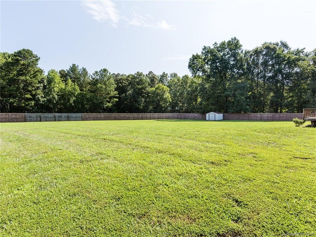 708 Baucom Road Monroe, NC 28110 - Photo 29 of 33 a view of a swimming pool and trees in the background