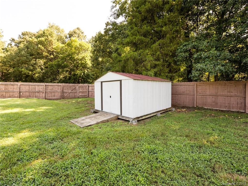 708 Baucom Road Monroe, NC 28110 - Photo 32 of 33 a view of backyard with green space