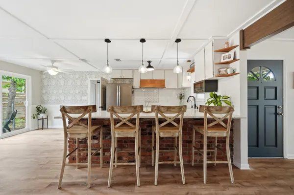 a view of a dining room with furniture window and wooden floor