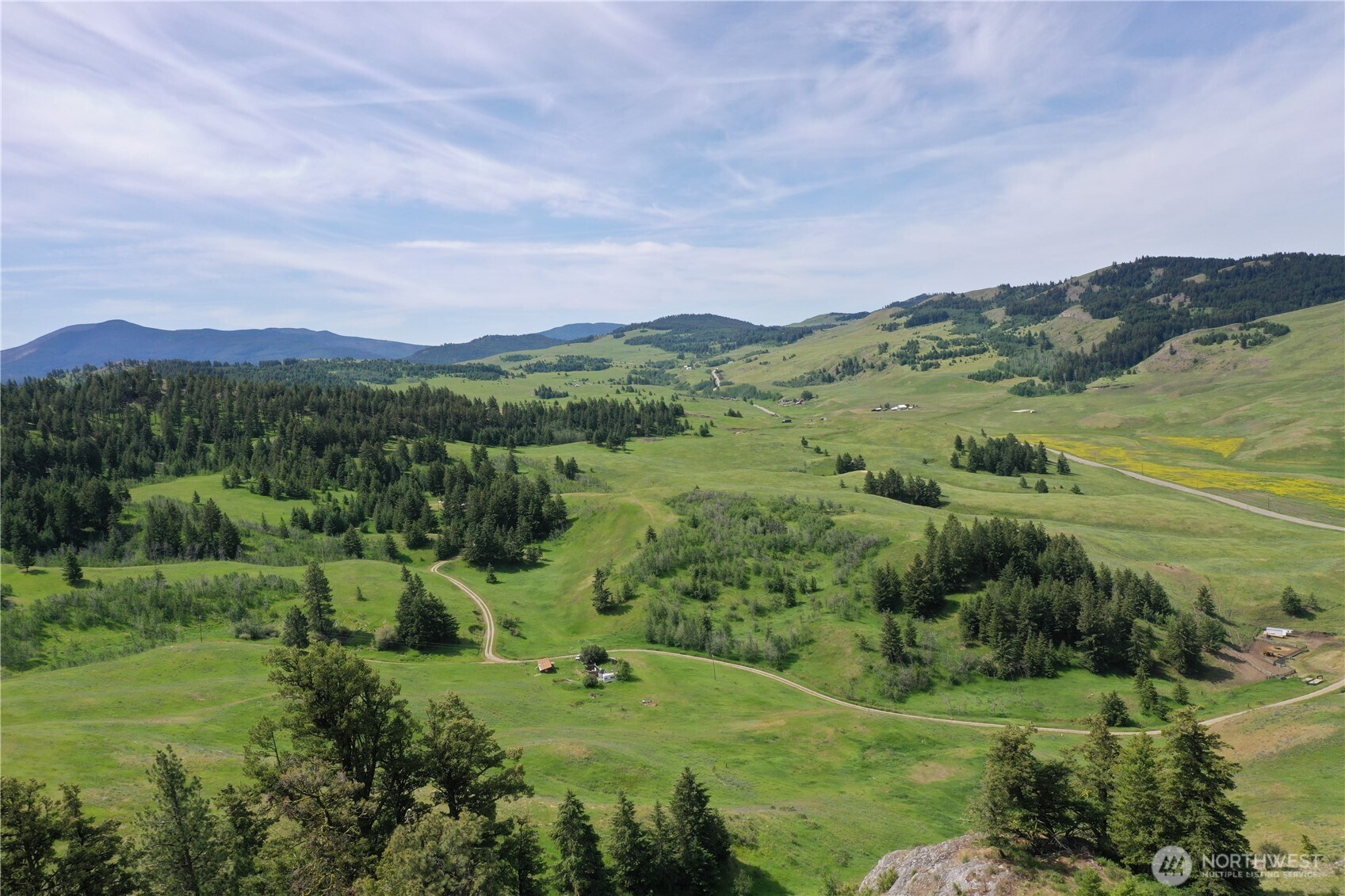 37 Turner Homestead Road Oroville, WA 98844 - Photo 31 of 39 a view of a lush green hillside and houses