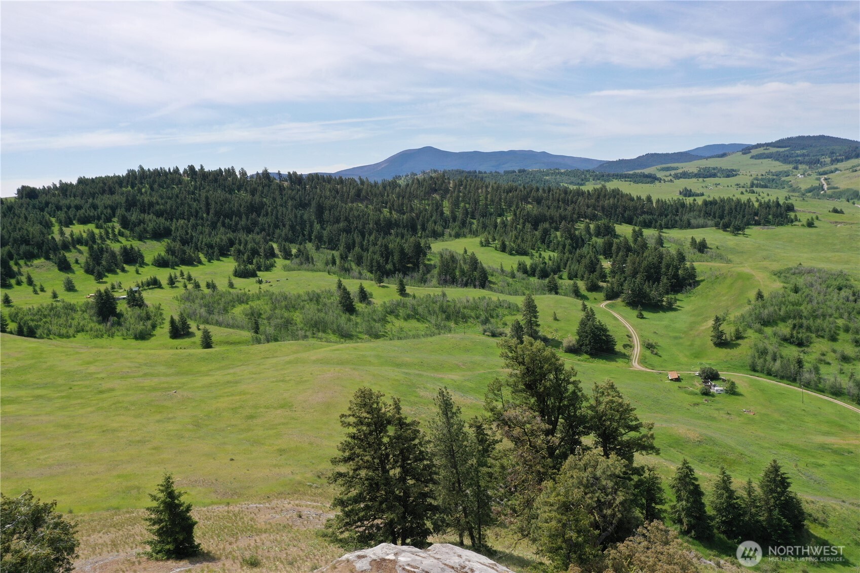 37 Turner Homestead Road Oroville, WA 98844 - Photo 32 of 39 a view of a lush green hillside and houses