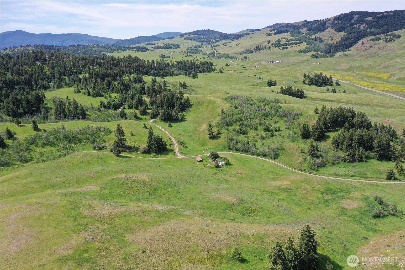 37 Turner Homestead Road Oroville, WA 98844 - Photo 35 of 39 a view of a lush green hillside and houses