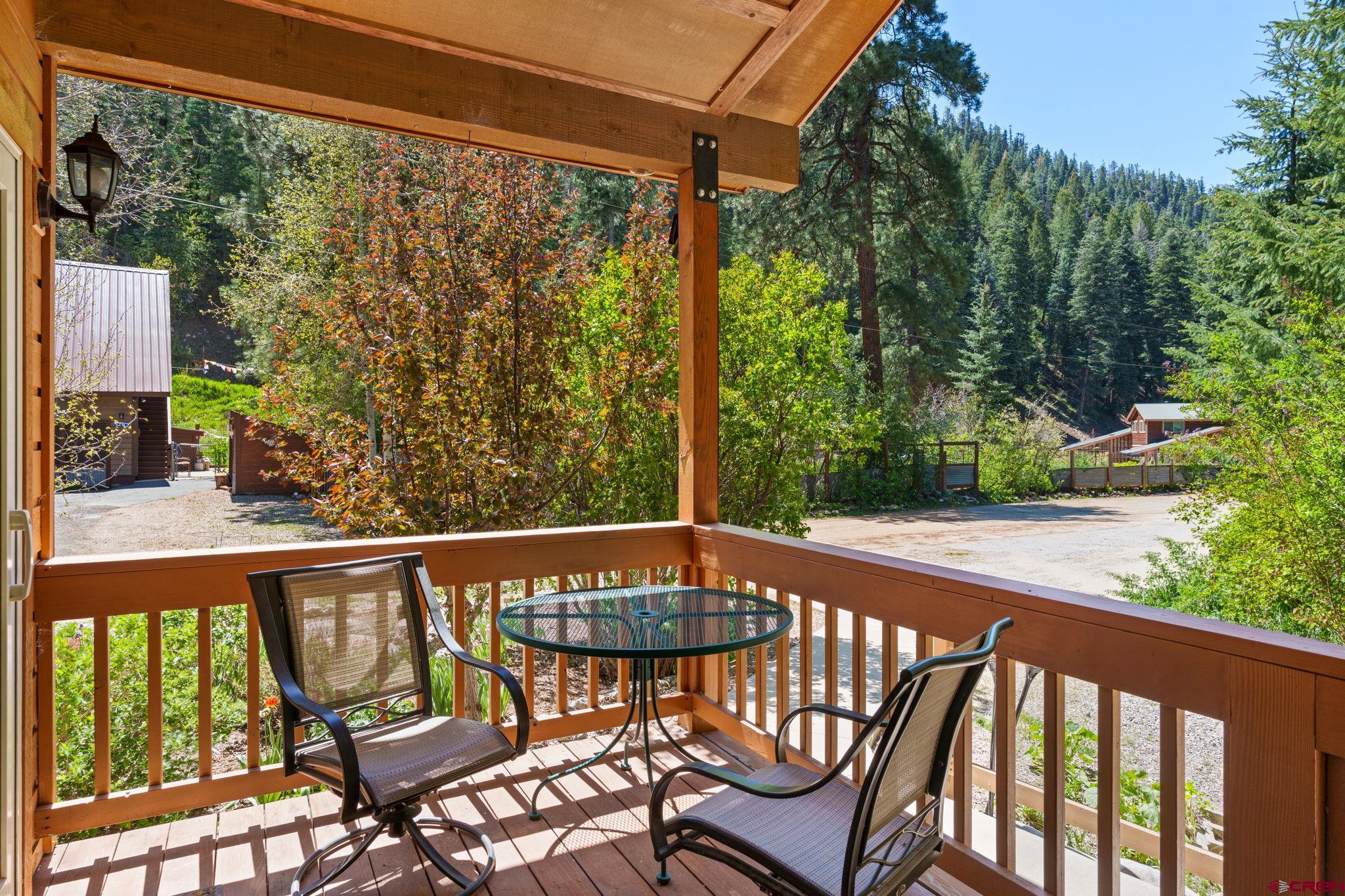 37 Verde Lane Durango, CO 81301 - Photo 6 of 45 a view of a chairs and table in patio