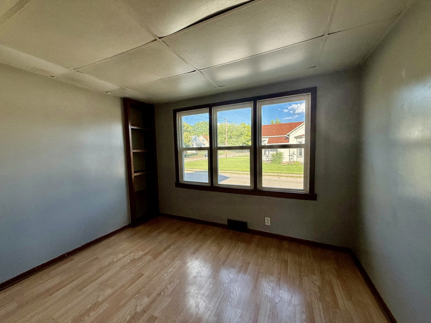 2302 1st Street Peru, IL 61354 - Photo 5 of 22 an empty room with wooden floor and windows