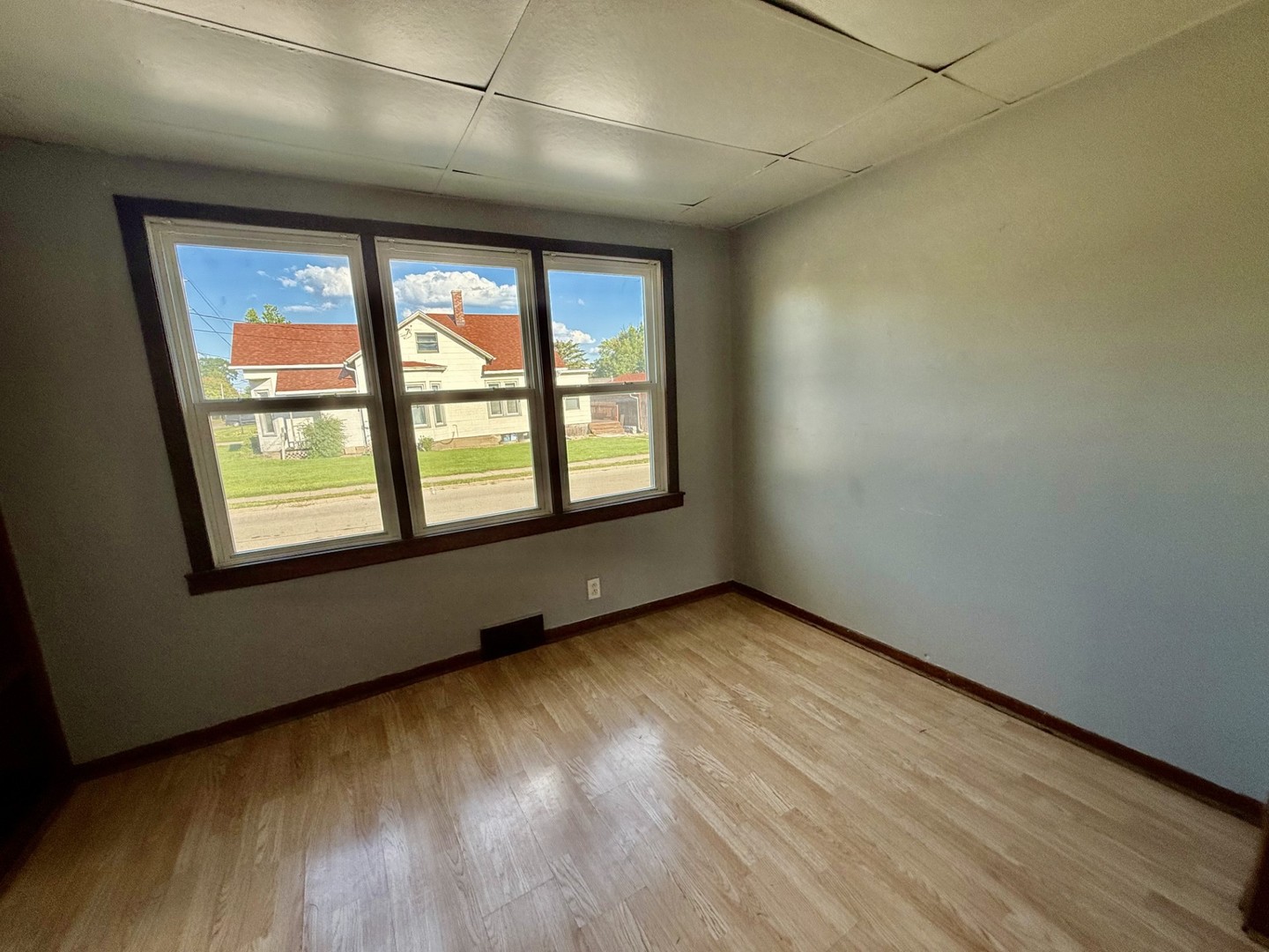 2302 1st Street Peru, IL 61354 - Photo 6 of 22 an empty room with wooden floor and windows