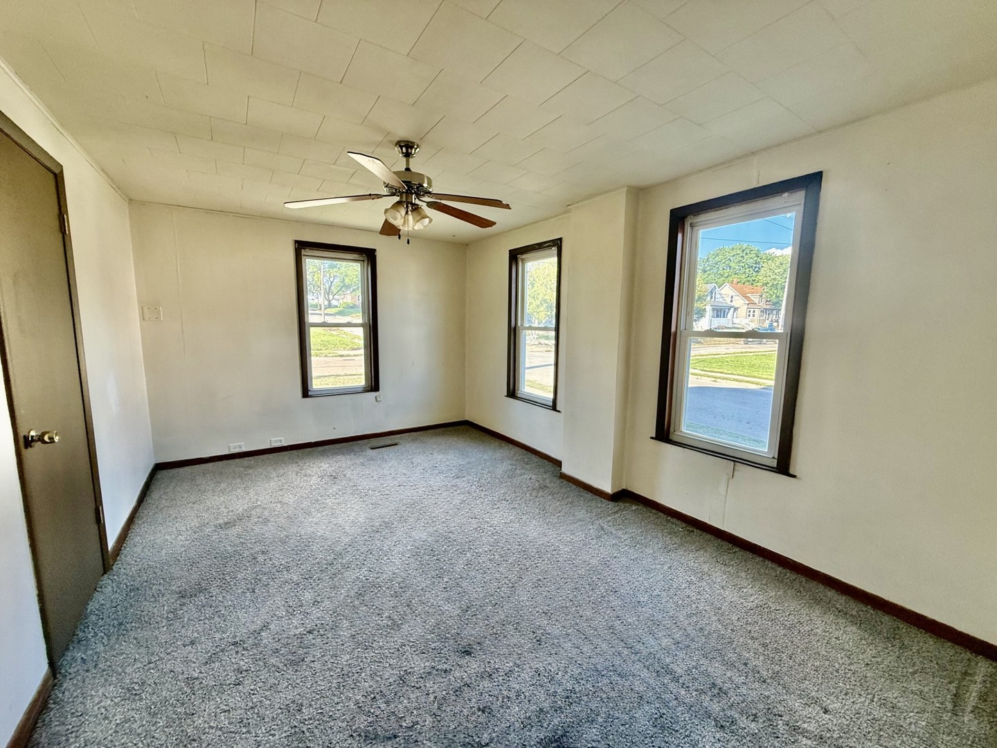 2302 1st Street Peru, IL 61354 - Photo 7 of 22 an empty room with windows and cabinet