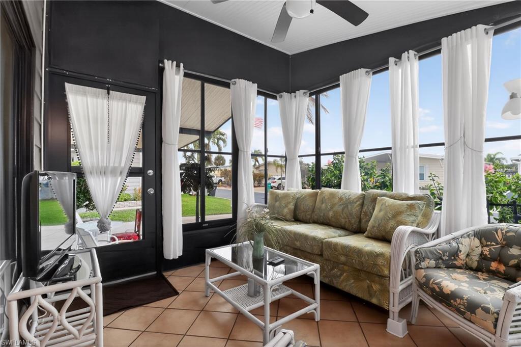 183 Oceans Boulevard, Unit 183 Naples, FL 34104 - Photo 26 of 28 Sunroom featuring tile patterned floors