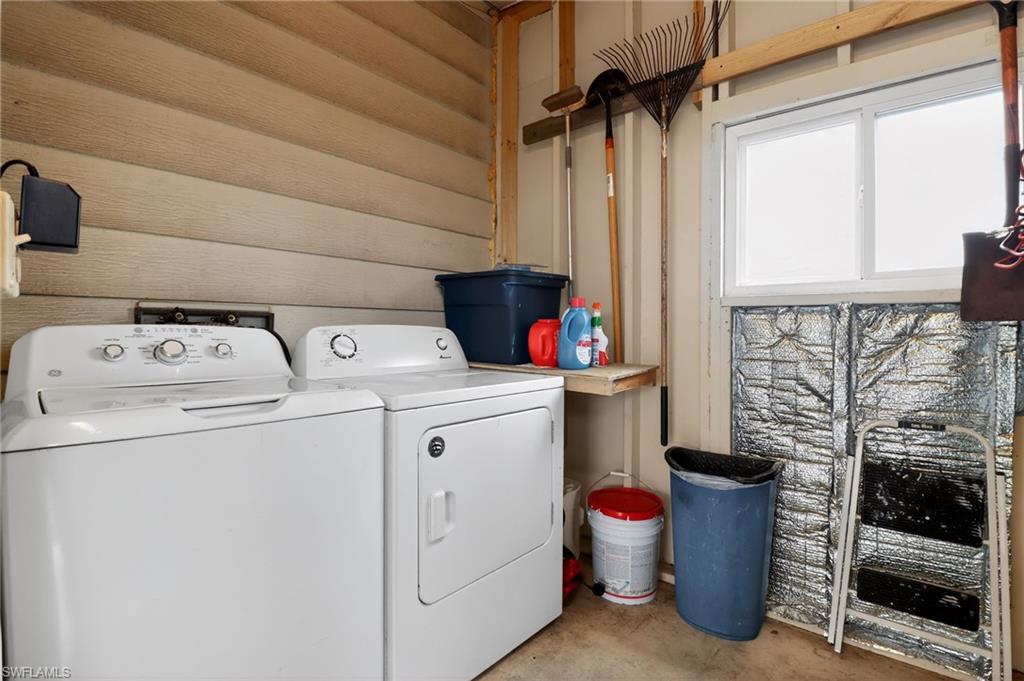 183 Oceans Boulevard, Unit 183 Naples, FL 34104 - Photo 28 of 28 Laundry area featuring concrete flooring and washing machine and dryer