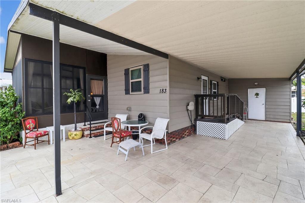 183 Oceans Boulevard, Unit 183 Naples, FL 34104 - Photo 4 of 28 View of patio featuring entry steps