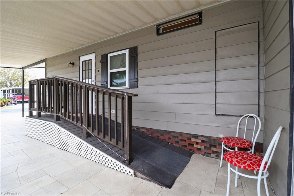 183 Oceans Boulevard, Unit 183 Naples, FL 34104 - Photo 5 of 28 View of exterior entry with a porch