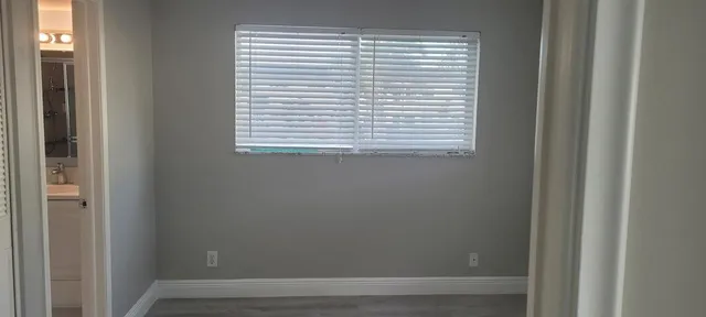 a bathroom with a sink a toilet and vanity