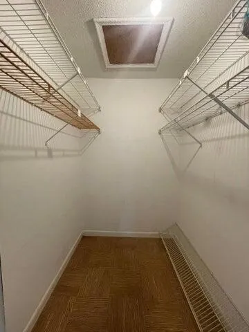 a kitchen with a refrigerator a stove top oven and a cabinets