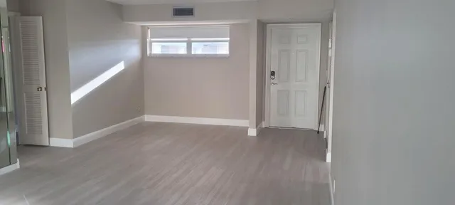 an empty room with windows